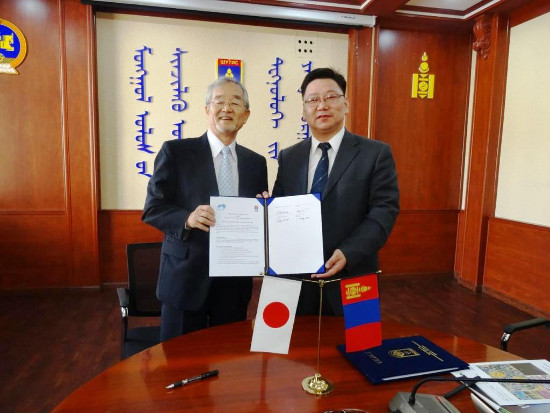 "NIMS President Sukekatsu Ushioda (left) and MUST President Baatar Ochirbat after signing" Image