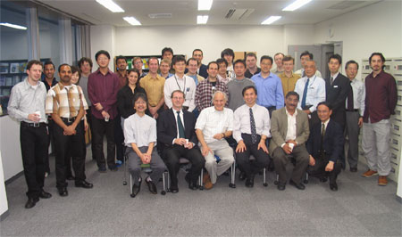 "Three professors pose with ICYS research fellows and staffs after a get-together." Image