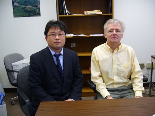 "Dr. Michael Lamm, Fermilab (right), with Dr. Kikuchi, Senior Researcher, SMC." Image