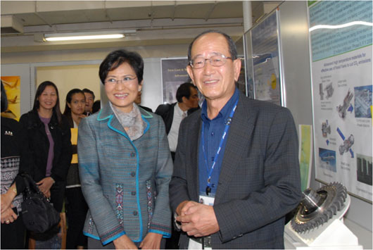 "Dr. Sophonpanich (left) at High Temperature Materials Center" Image