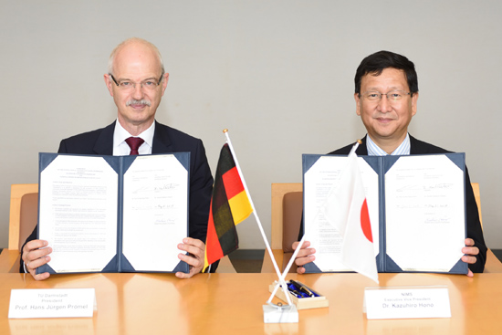"Signing Ceremony at NIMS. Prof. Hans Jurgen Promel (President of TU Darmstadt; left) and Dr. Kazuhiro Hono (Executive Vice President of NIMS)." Image
