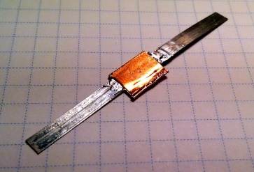 "Figure used in the press release. Two rare earth-based superconducting wires jointed together using a superconducting solder" Image