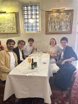Participants seated around a table during a post-workshop dinner