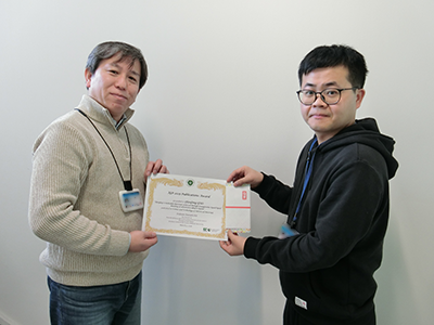 Photo of  Takashi Nakanishi, Group Leader and Zhenfeng Guo, NIMS Postdoctoral Researcher